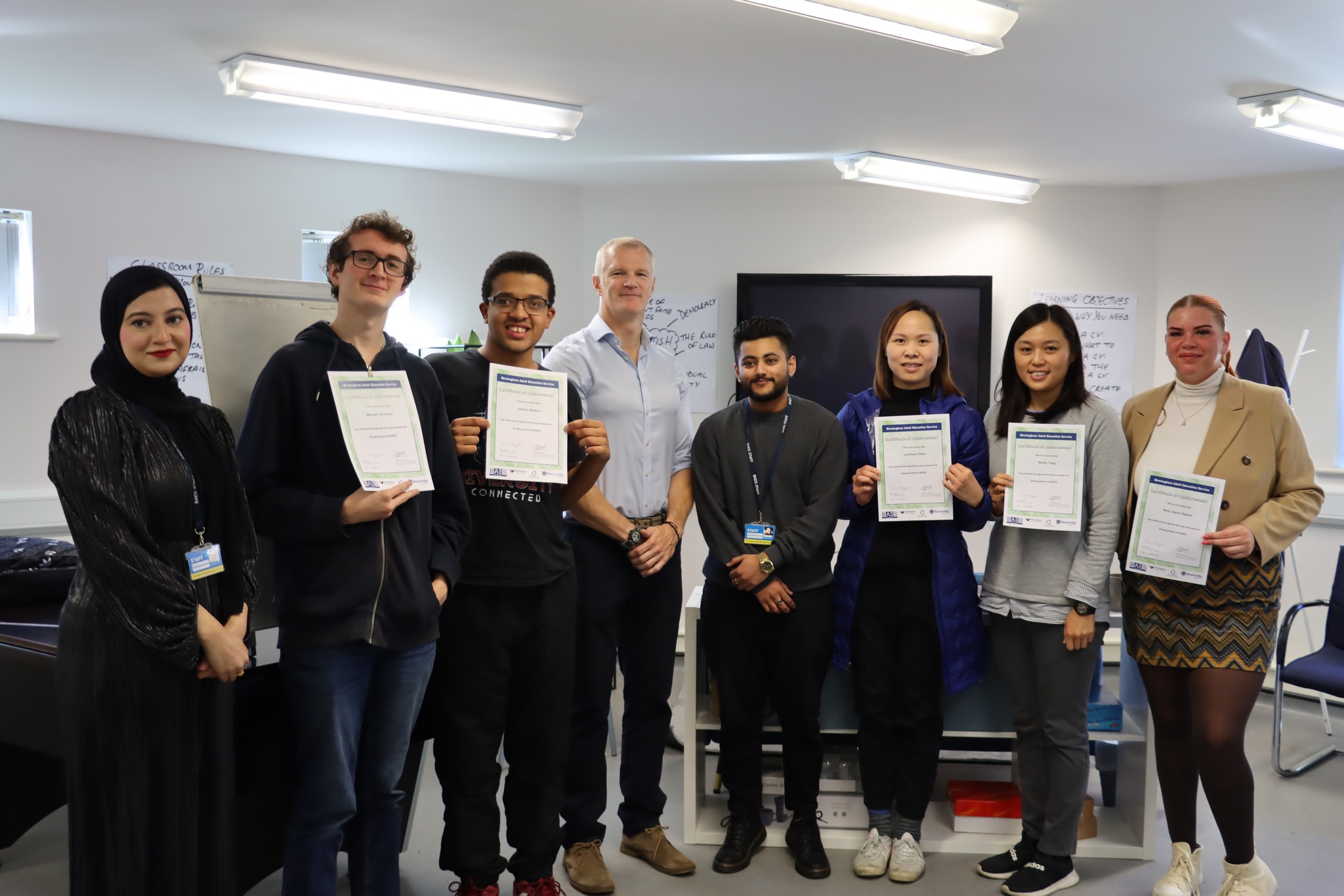 Al Carns with learners and their certificates